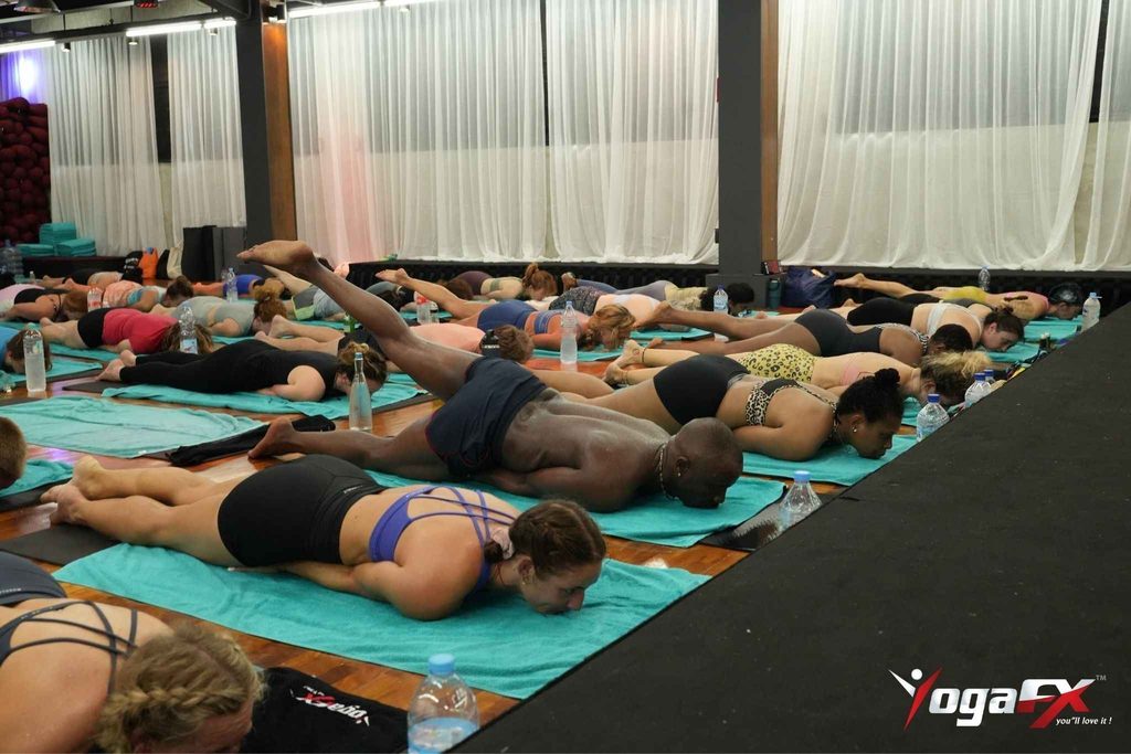 Inside YogaFX's heated hot yoga studio in Seminyak, Bali, held at natural tropical heat around 40 degrees Celsius for beginner classes.