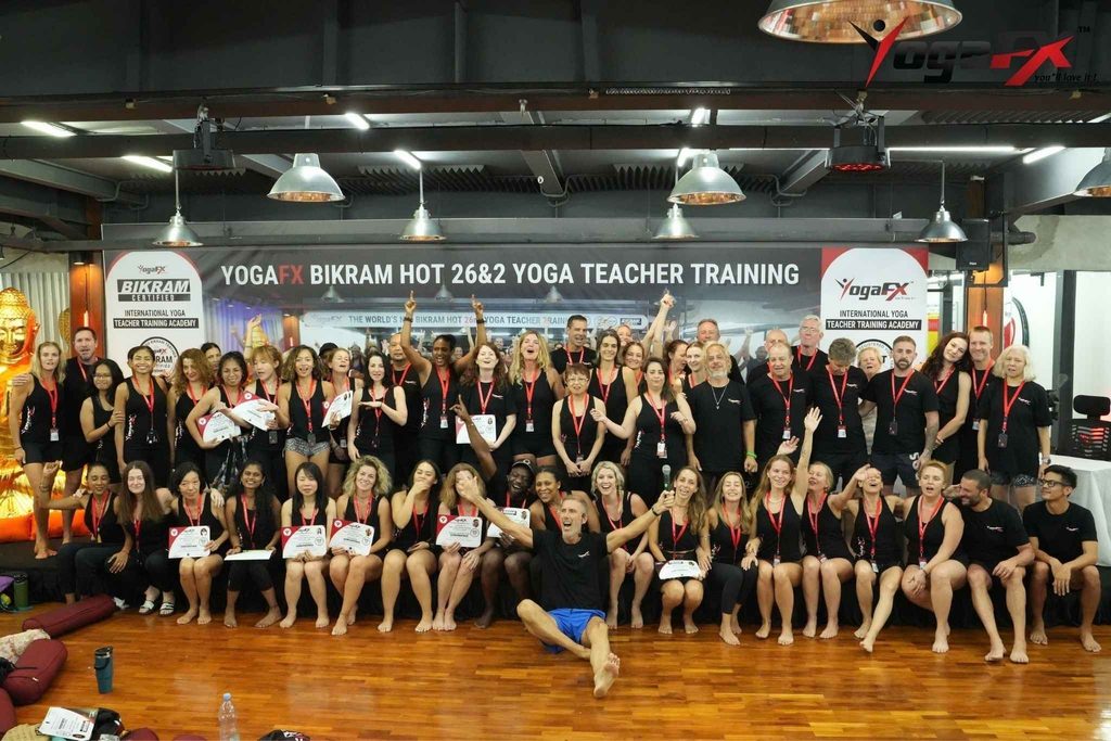 YogaFX graduates holding Yoga Alliance RYT 200 and Bikram Hot 26&2 certificates after completing yoga teacher training in Bali